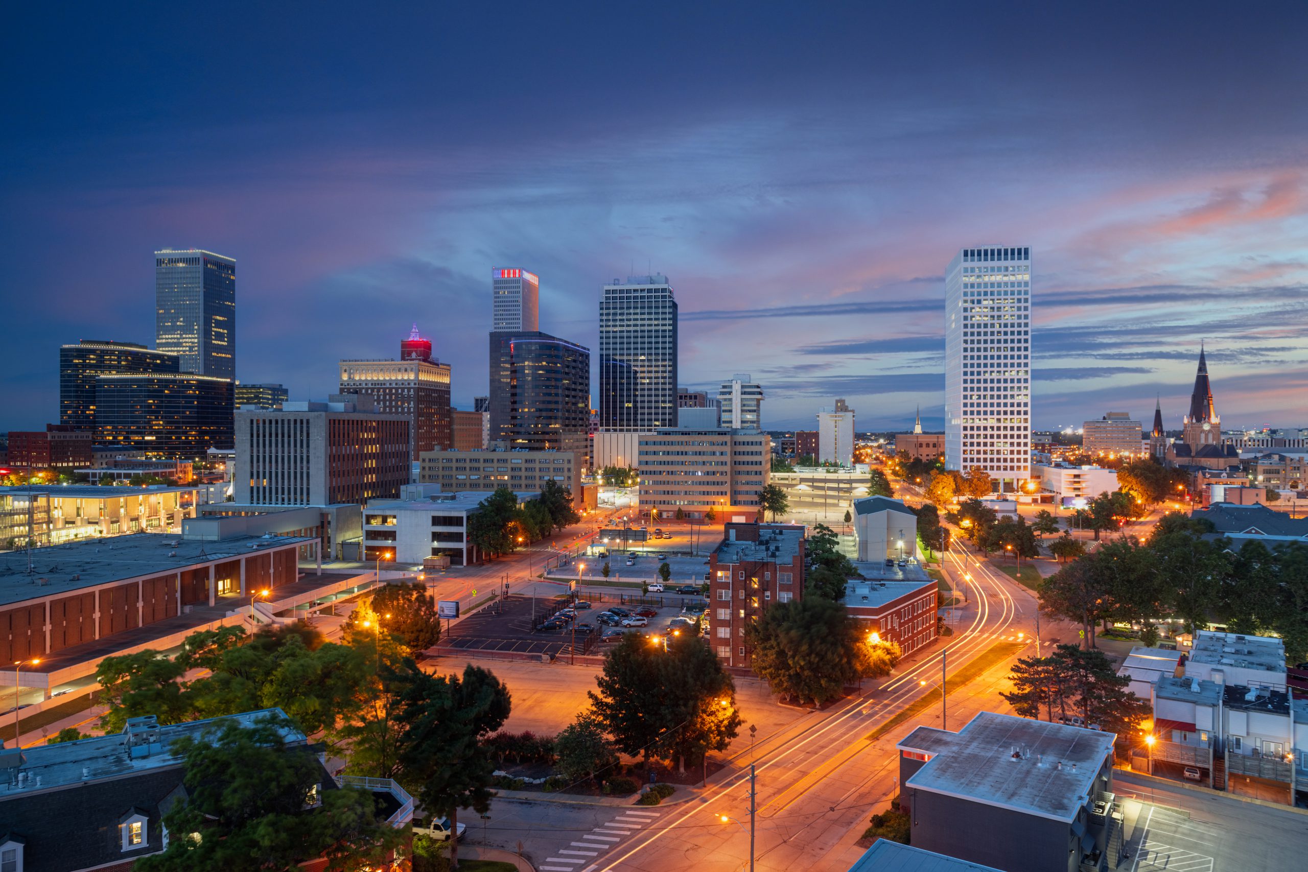 The office buildings of downtown Tulsa in the evening. The Troutman & Troutman disability law firm is based in Tulsa and serves all of Oklahoma.