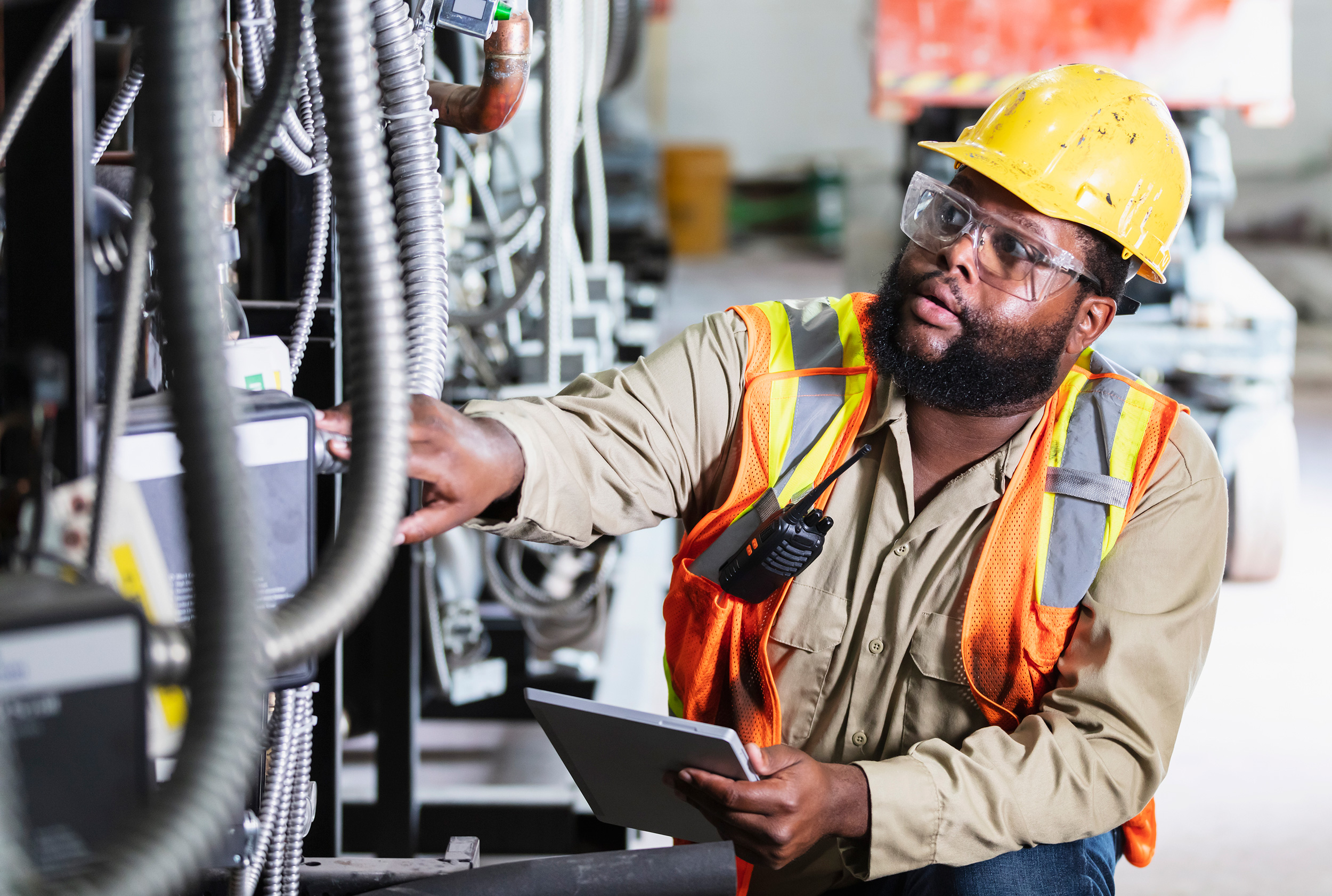 Wearing his safety helmet and vest, a worker checks out industrial equipment. Your record of past relevant work goes into deciding whether you can get Social Security Disability benefits.