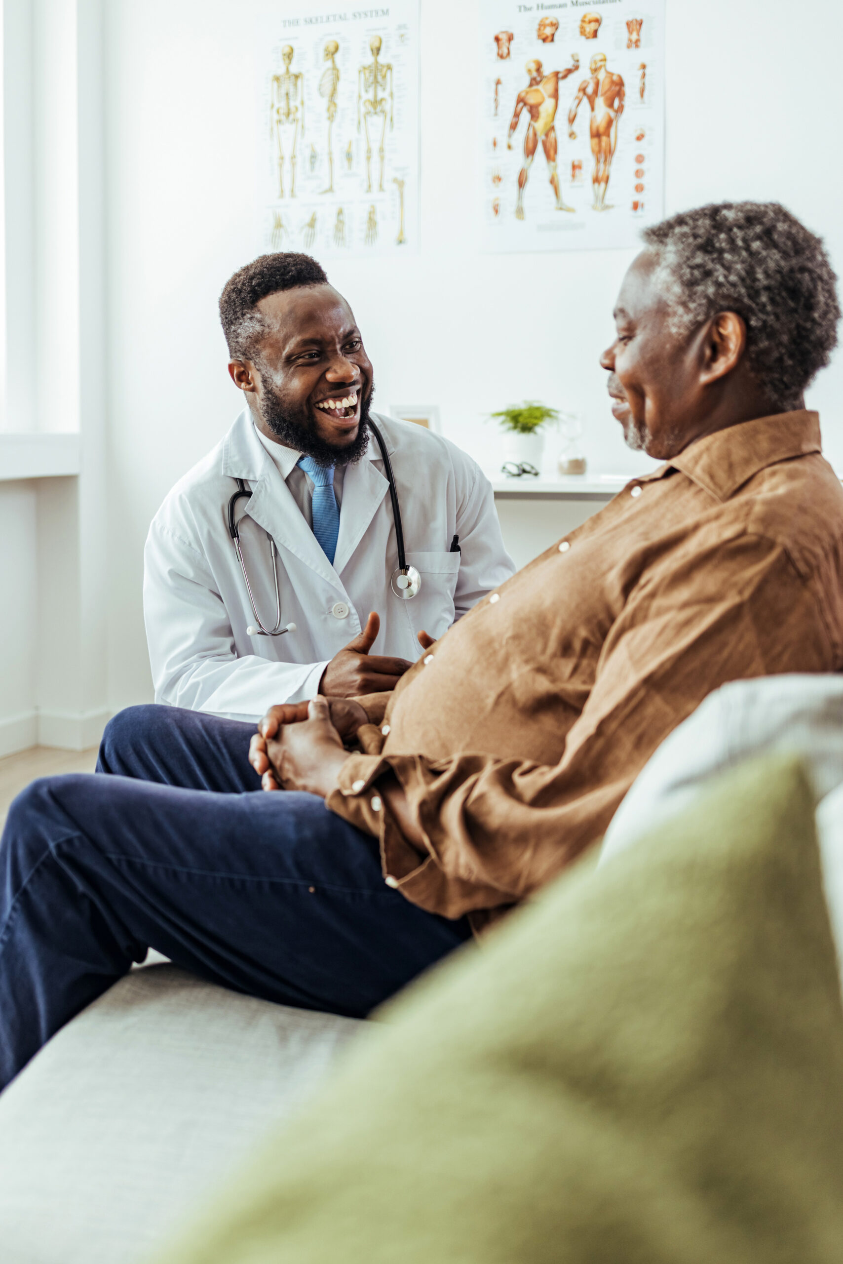 A doctor smiles while he talks to his patient on an examination table. The Owasso Social Security Disability lawyers at Troutman & Troutman help you through the five steps of qualifying for Social Security Disability benefits.