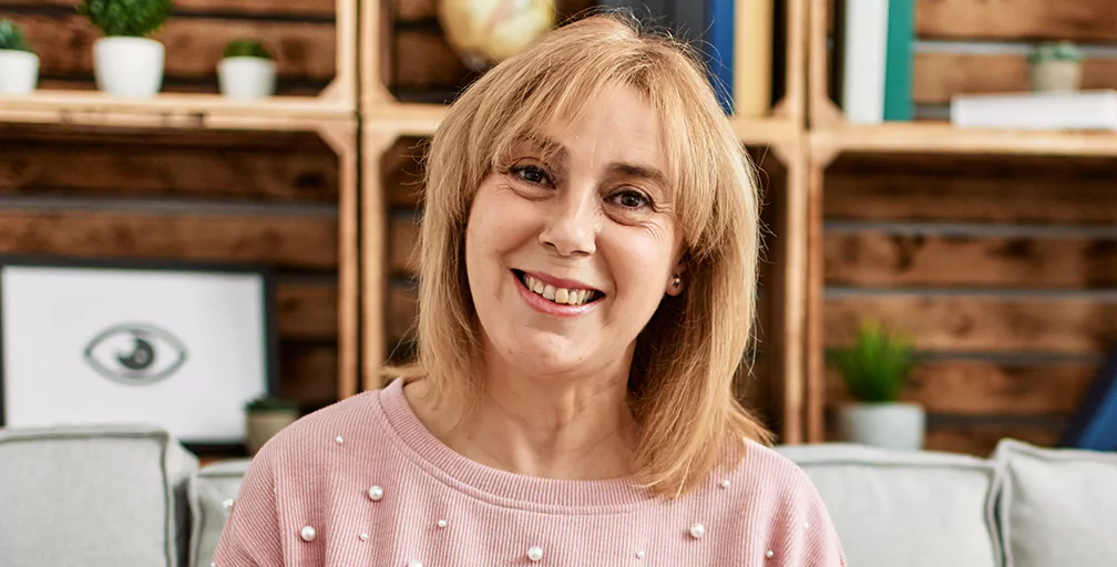 Happy woman figuring out her chances of winning disability benefits.